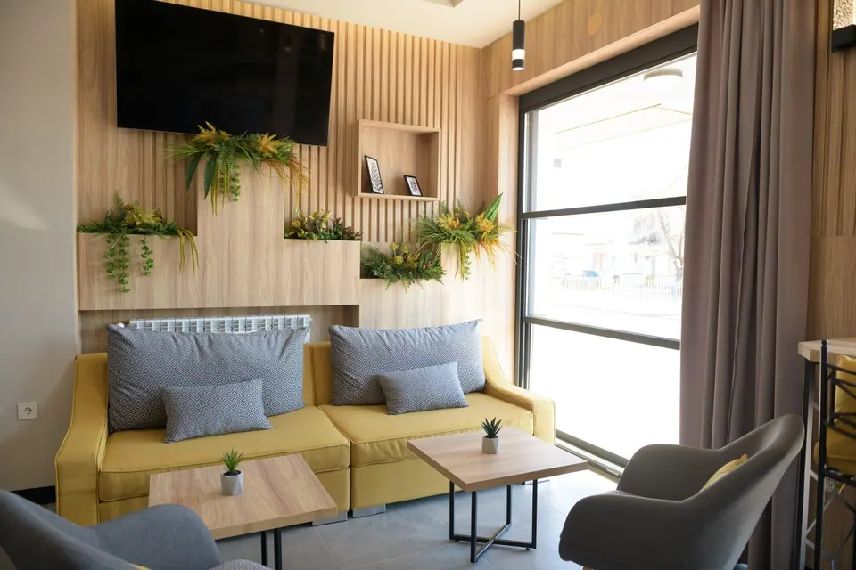 Lounge with sofas and greenery – Forum City Hotel, Pazardzhik